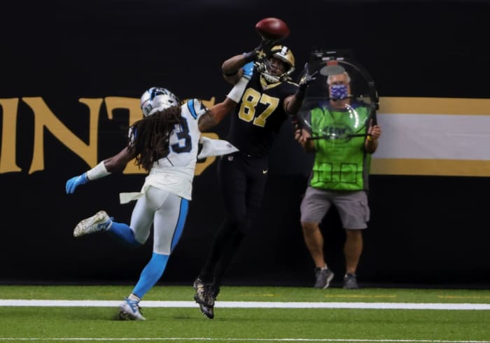 Oct 25, 2020; New Orleans, Louisiana, USA; Saints tight end Jared Cook (87) catches a touchdown over Carolina safety Tre Boston (33). Mandatory Credit: Derick E. Hingle-USA TODAY